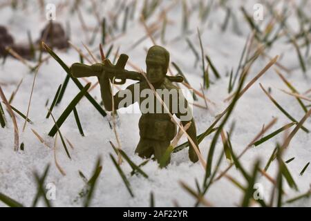A Toy Soldier Holding Post in the Deep Snow Stock Photo