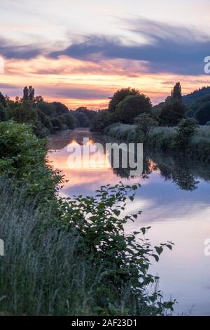 Pont-Audemer (north-western France): the Risle river at dusk. The town is located in the Risle Valley in the "Boucles de la Seine Normande" Regional N Stock Photo