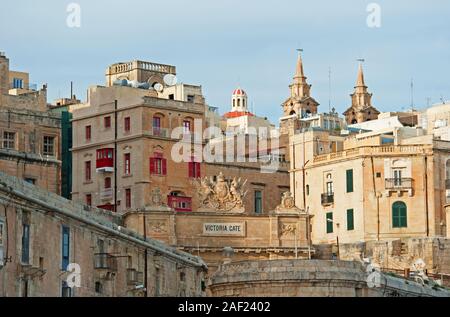 Victoria Gate and the waterfront buildings in Valletta, Malta Stock Photo