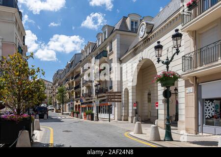 Le Plessis-Robinson (Paris area): real estate and view of the Grande Rue street from the Grand Place square, in the district of Coeur de ville. Stock Photo