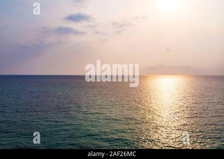 Sea surface reflecting sky sun holiday. Reflection of the sun in sea water Stock Photo