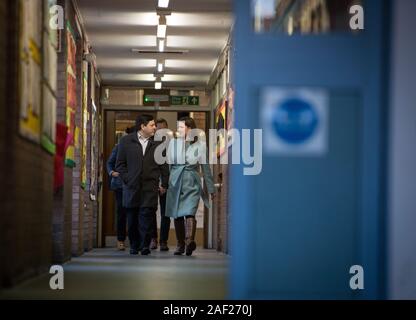 Glasgow, UK, 12 December 2019. Jo Swinson, leader of the Liberal Democrats party, accompanied by her husband Duncan Hames, leaves Castlehill Primary School in Glasgow, after casting her vote in the 2019 General Election. Credit: Jeremy Sutton-Hibbert/Alamy Live News. Stock Photo