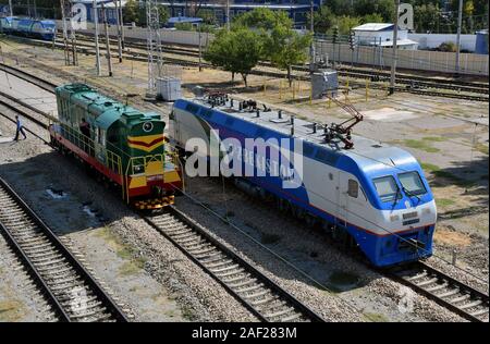 Diesel locomotive CME3T-7396 and electric locomotive OZ-Y0113 on 11.09.2019 in the station Tashkent - Uzbekistan. | usage worldwide Stock Photo