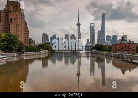 Shanghai, China - November 2019: Waibaidu bridge, reflections and Shanghai Pudong skyline. Stock Photo