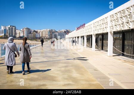 Morocco, Tangier: Tanja Marina Bay International (TMBI). Walkers on the waterfront Stock Photo