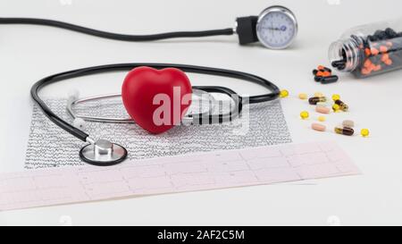 Stethoscope on cardiogram and toy heart. Concept healthcare. Cardiology - care of the heart Stock Photo