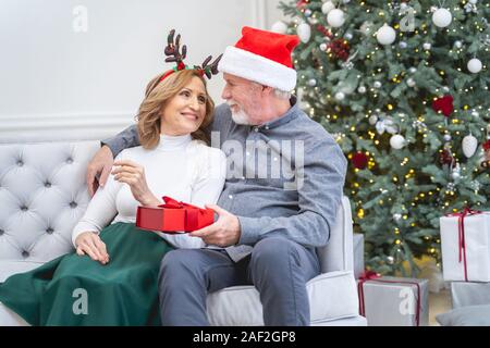 Joyful mature people looking at each other Stock Photo