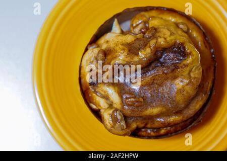 Sticky bun on a plate Stock Photo
