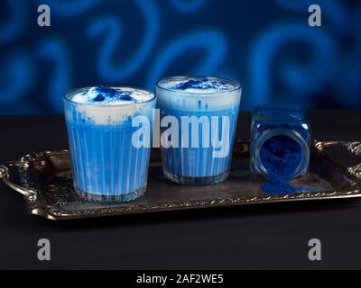 A blue latte colored with natural phycocyanin extracted from blue spirulina algae Stock Photo