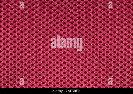 Close up of burgundy red or pink mesh textile fabric Stock Photo