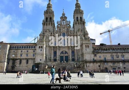 Pilgrims taking pictures in front of Cathedral at Praza do Obradoiro. Santiago de Compostela, Spain. Dec 1, 2019.