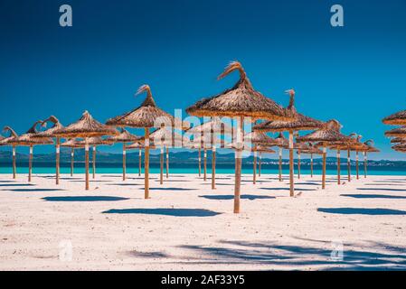 Summer vacation concept photo. Umbrellas on a tropical beach. Summer vacation concept photo Stock Photo