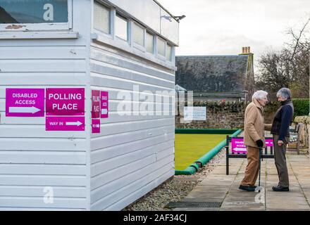 Gullane Bowling Club, East Lothian, Scotland, United Kingdom, 12th December 2019. UK election: elderly voters at the local polling place Stock Photo