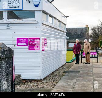 Gullane Bowling Club, East Lothian, Scotland, United Kingdom, 12th December 2019. UK election: elderly voters at the local polling place Stock Photo