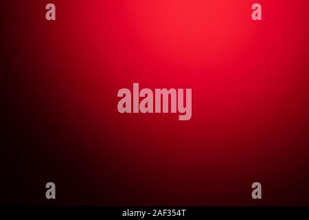 red blurred background with strong black gradient and vignette. Stock Photo