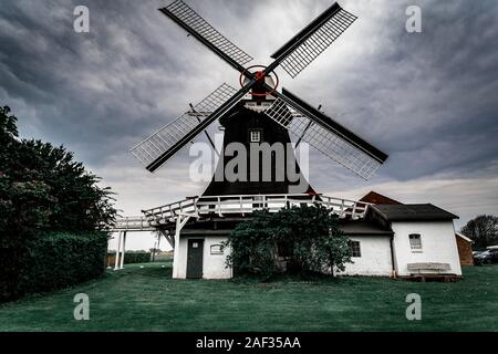 Old wooden windmill in dark tones Germany Stock Photo