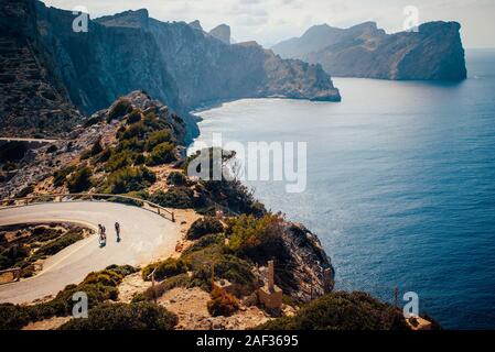 couple of cyclist on the road in Cap de Formentor. Mallorca, Spain Stock Photo