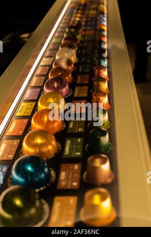 Moscow, Russia - December 01, 2019: Set of different flavors of Nespresso coffee. Small Nespresso coffee capsule, large Vertuo and small original caps Stock Photo