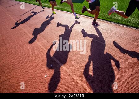 Runners on the track, silhouette, athletics sport photo Stock Photo