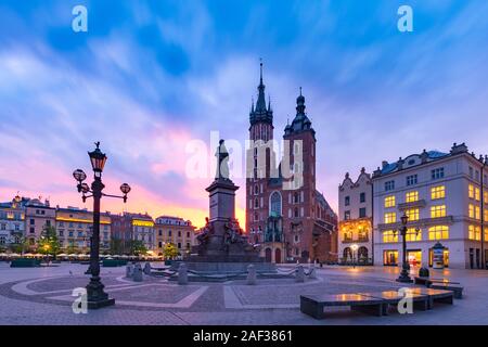Medieval Main market square with Basilica of Saint Mary at gorgeous sunrise in Old Town of Krakow, Poland
