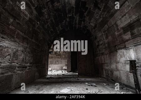 Mystical interior of dark corridor in an old abandoned palace Stock Photo