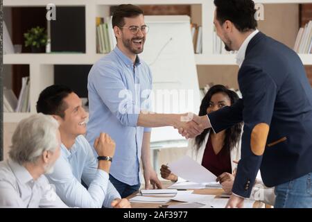 Successful business partners shaking hands starting or finished meeting Stock Photo