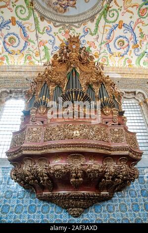 Pipe organ in the interior of the Capela de Sao Miguel (Saint Michael's Chapel) of University of Coimbra, Portugal Stock Photo