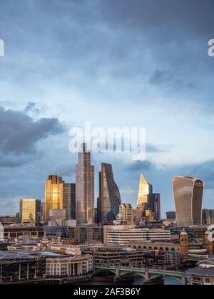 Sun Setting on The City of London, City of London Skyline, River Thames, London, England, UK, GB. Stock Photo