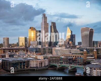 Sun Setting on The City of London, City of London Skyline, River Thames, London, England, UK, GB.