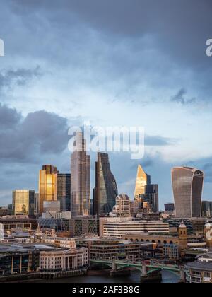 Sun Setting on The City of London, City of London Skyline, River Thames, London, England, UK, GB. Stock Photo
