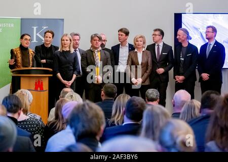 12 December 2019, Berlin: Sylvia Amann (left to right), Chairwoman of the European Jury, speaks at an event to announce the pre-selection in the application procedure for the 'European Capital of Culture 2025' in Germany at the State Representation in Hamburg next to representatives of the cities that have been pre-selected. Eight candidate cities recommended Magdeburg, Hanover, Nuremberg, Chemnitz and Hildesheim for the second round of the application procedure for the title 'European Capital of Culture 2025'. Which city may bear the title 'European Capital of Culture' in 2025 will be decided Stock Photo