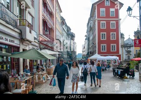 Pedestrian street of Rua Visconde da Luz in Coimbra, Portugal with an arts and crafts fair Stock Photo