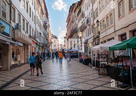 Pedestrian street of Rua Visconde da Luz in Coimbra, Portugal with an arts and crafts fair Stock Photo