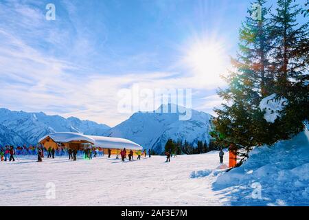 People skiing and snowboarding on Penken Park ski resort Austria Stock Photo