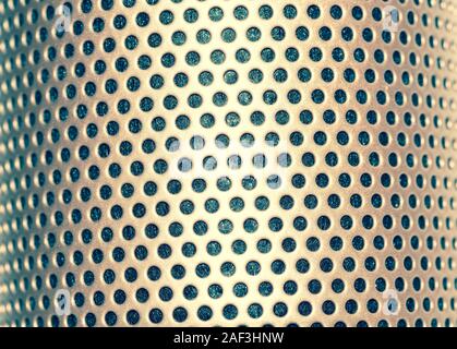 Multicolour abstraction, colourful array of holes in the metal sheet Stock Photo