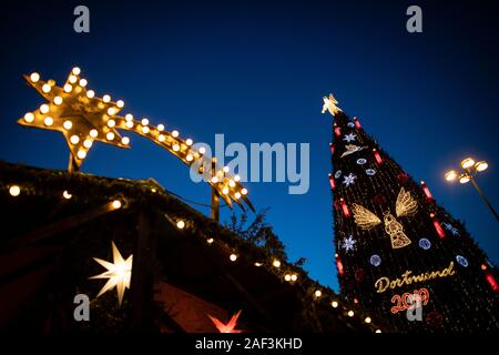 Dortmund, Germany. 12th Dec, 2019. According to the organizers, the largest Christmas tree in the world, built from around 1700 individual red spruces from the Sauerland region, is on display at the Christmas market. Credit: Bernd Thissen/dpa/Alamy Live News