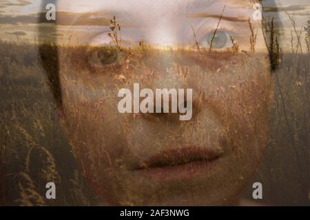 Conceptual dramatic large-face portrait of a woman. Photo montage of two photos. Stock Photo
