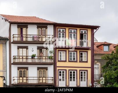Guimaraes, Portugal - 18 August 2019: Traditional houses overlooking the main square in Guimaraes Stock Photo