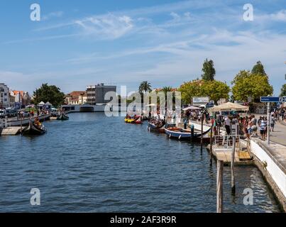 Aveiro, Portugal - 19 August 2019: Main canal through the center of Aveiro with tourists on tour boats Stock Photo