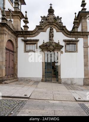 Guimaraes, Portugal - 18 August 2019: Doorway into the Nossa Senhora do Carmo church with steps Stock Photo