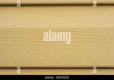 Soft yellow siding, texture and horizontal plastic background. 2019 Stock Photo
