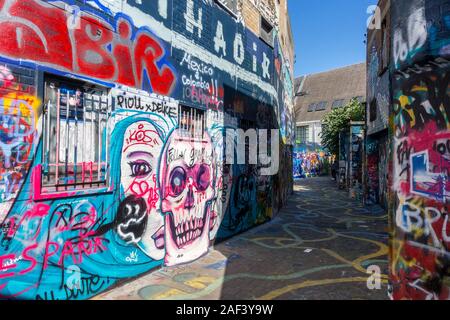 Colourful graffiti on wall in alley Werregarenstraatje in the city Ghent / Gent, East Flanders, Belgium Stock Photo