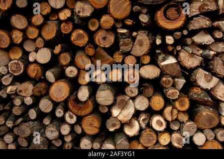 The texture of the wall is firewood, which is laid out very neatly. 2019 Stock Photo