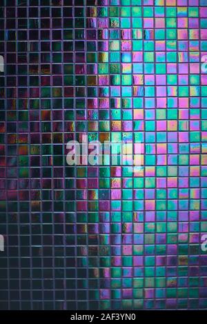 Fragment of the background pattern from the mosaic tiles with a backlight on the wall Stock Photo