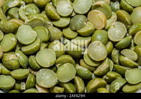 Background with peas in the foreground Stock Photo