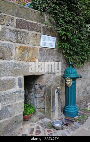 Cast iron Water fountain.  Original Victorian water fountain re-installed in 2016.  Robin Hood's Bay. Stock Photo