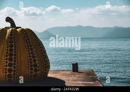 Yayoi Kusama's giant yellow pumpkin sculpture in Naoshima. October 25, 2018 in the early afternoon on Naoshima Art Island. Stock Photo