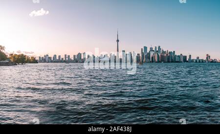 View of CN Tower and Toronto skyline from Toronto Islands Park at sunset. Stock Photo