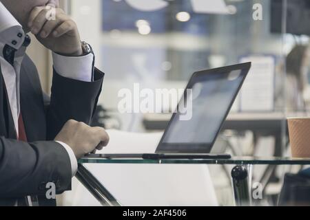 working on laptop, close up of hands of business man Stock Photo