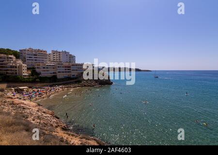 People having fun at Cala Llenguadets beach in Salou, a famous tourist destination at summer in Spain Stock Photo